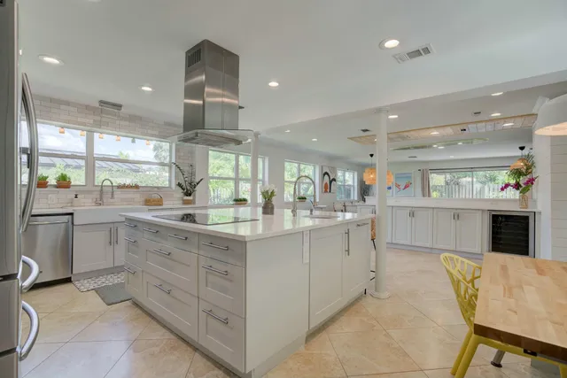 a kitchen with counter top space cabinets and window