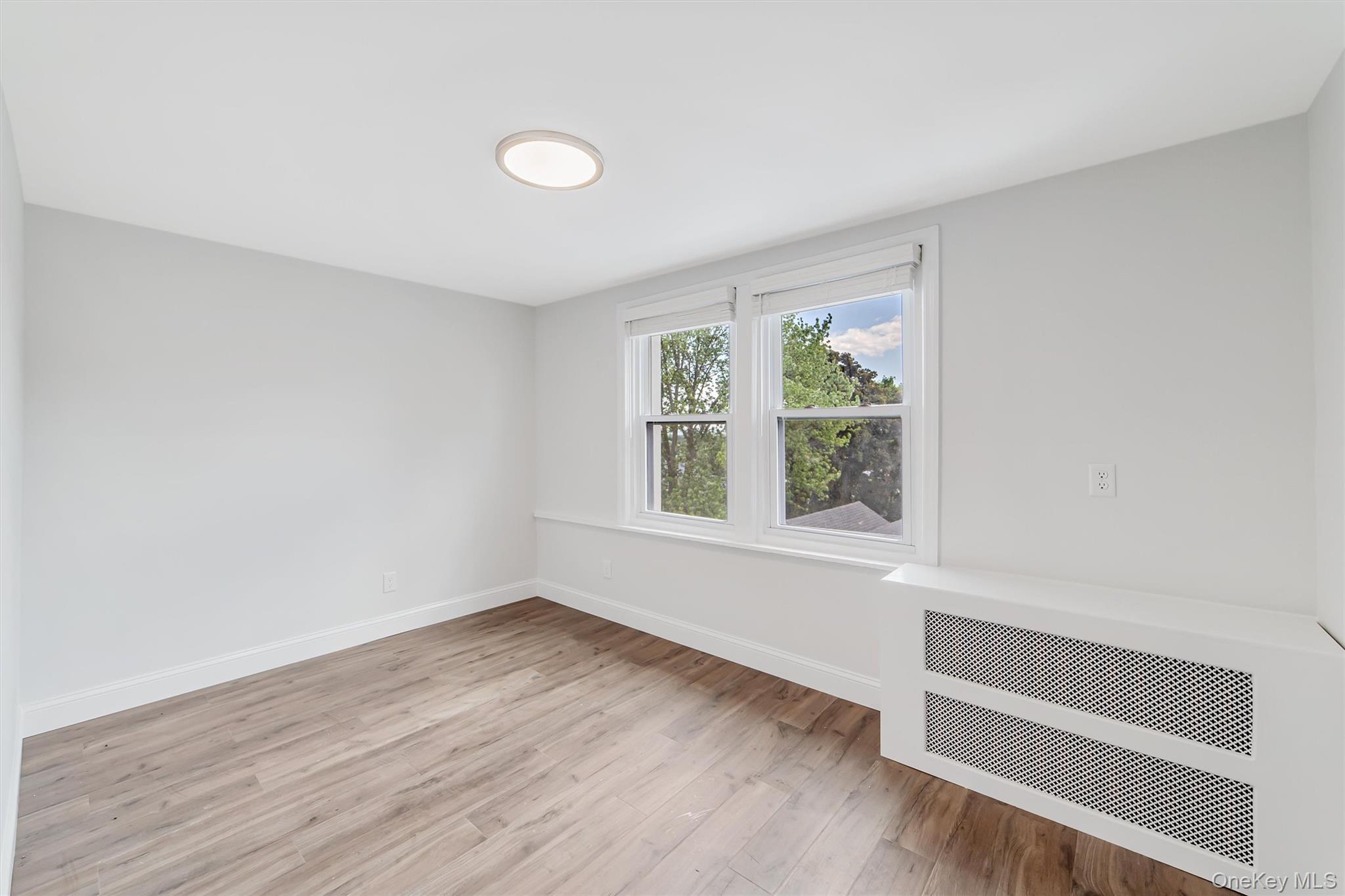 69 Prospect Street, Unit 2 Port Chester, NY 10573 - Photo 17 of 29 a view of room with window and hardwood floor