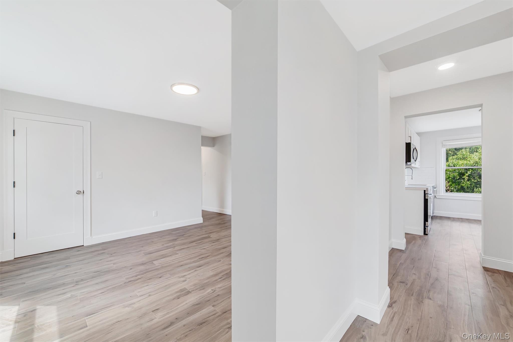 69 Prospect Street, Unit 2 Port Chester, NY 10573 - Photo 20 of 29 a view of a room with wooden floor and a window