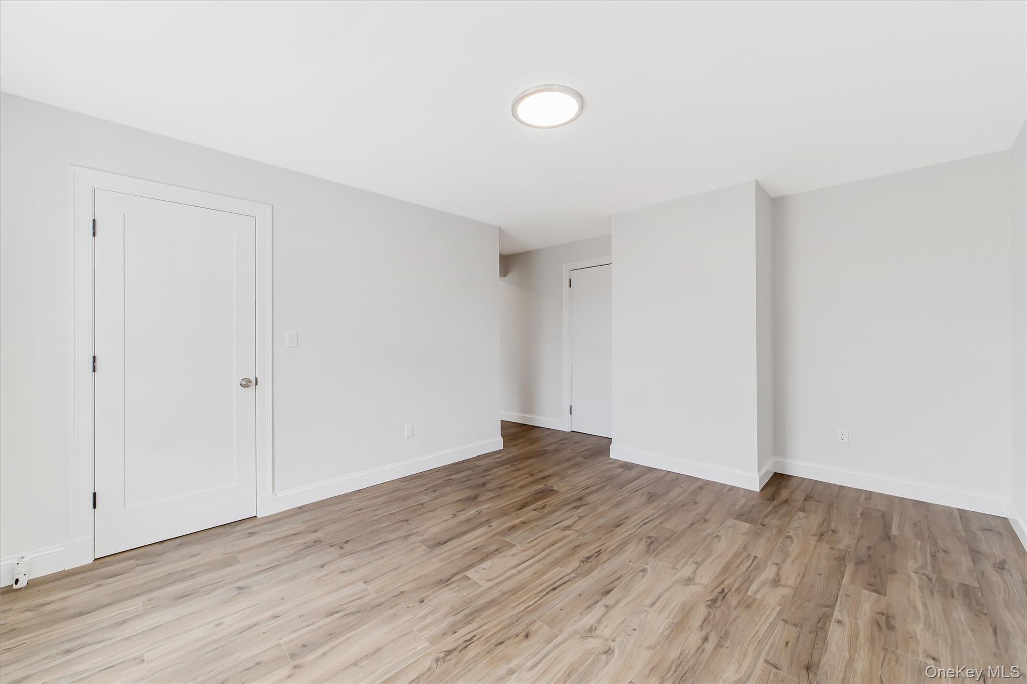 69 Prospect Street, Unit 2 Port Chester, NY 10573 - Photo 21 of 29 a view of empty room with wooden floor