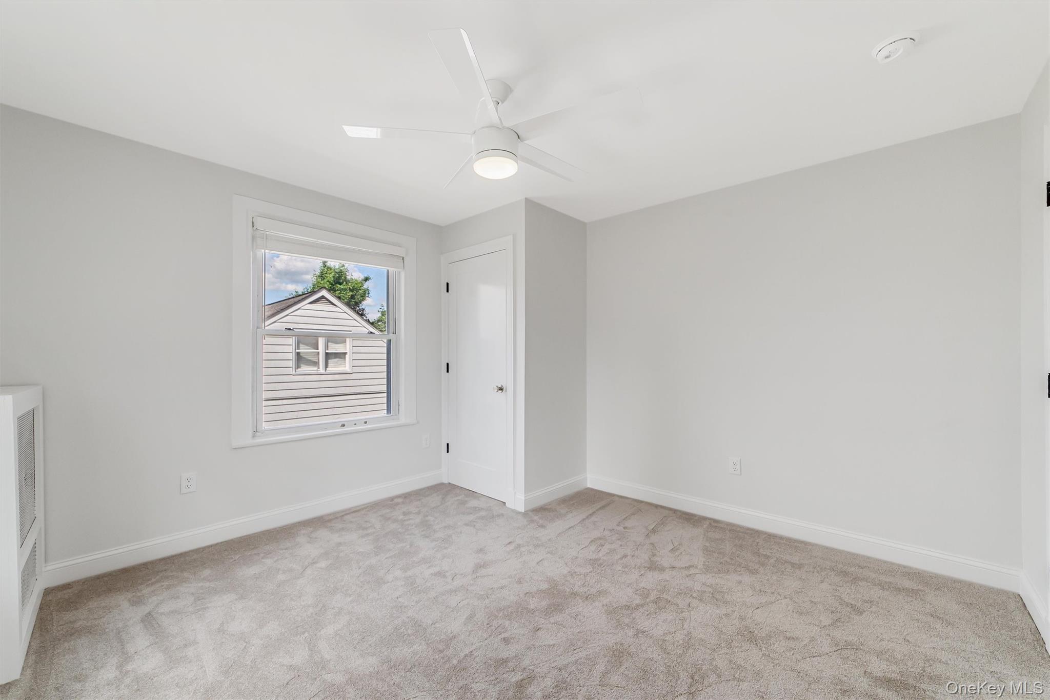 69 Prospect Street, Unit 2 Port Chester, NY 10573 - Photo 28 of 29 an empty room with windows