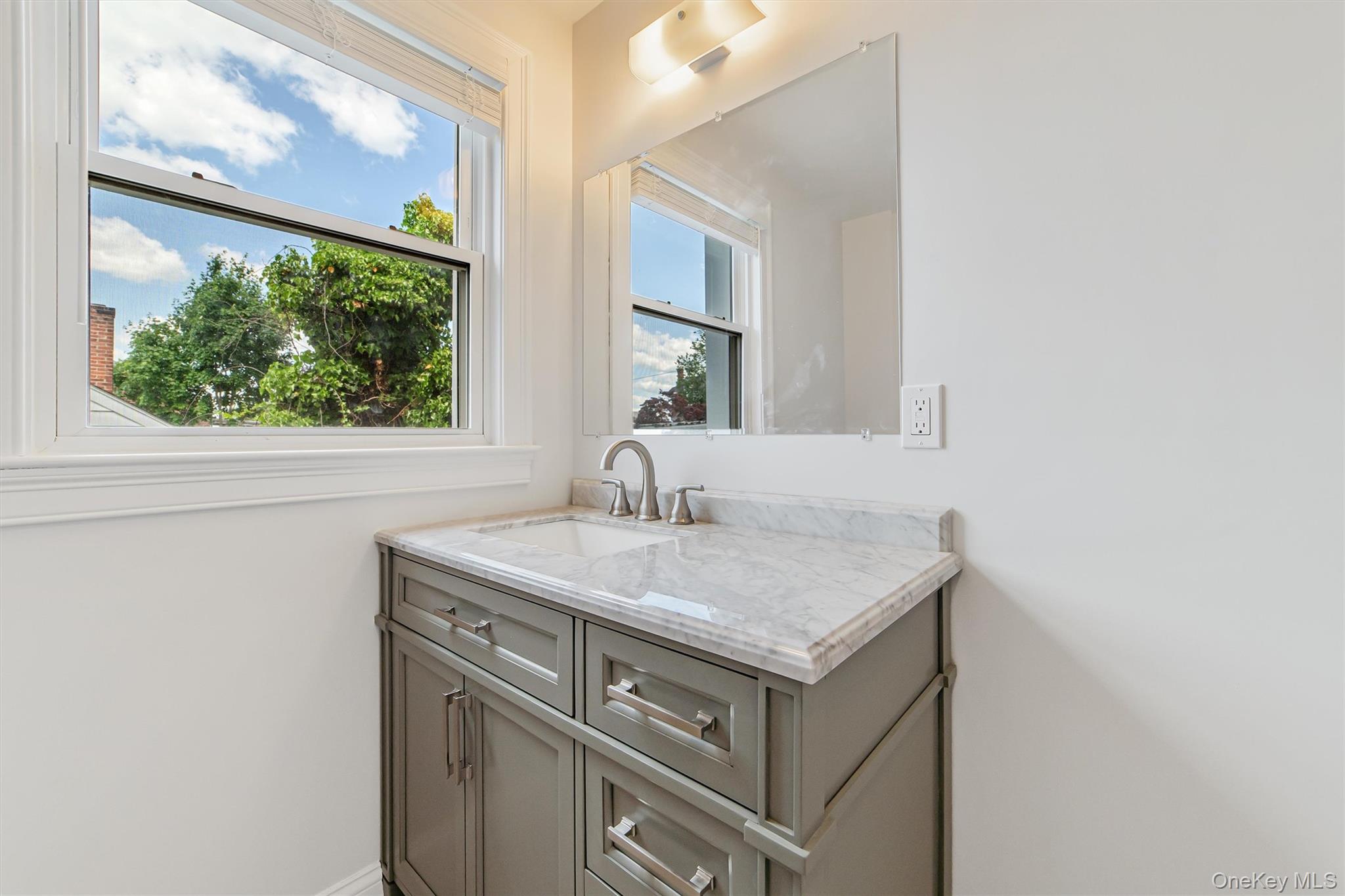 69 Prospect Street, Unit 2 Port Chester, NY 10573 - Photo 8 of 29 a view of a sink and a mirror
