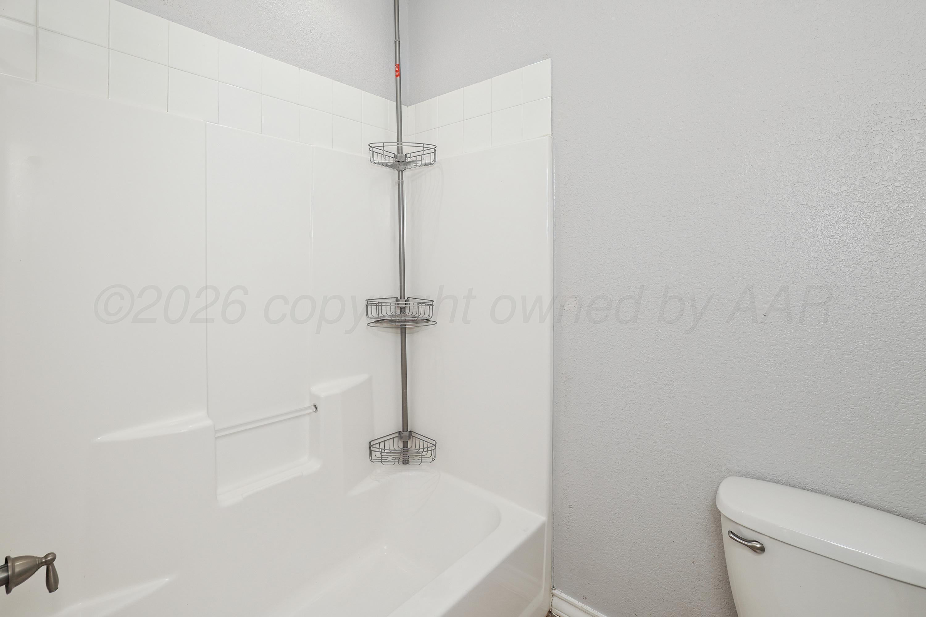19101 Sundancer Lane Bushland, TX 79124 - Photo 21 of 25 a bathroom with a sink a toilet and a shower