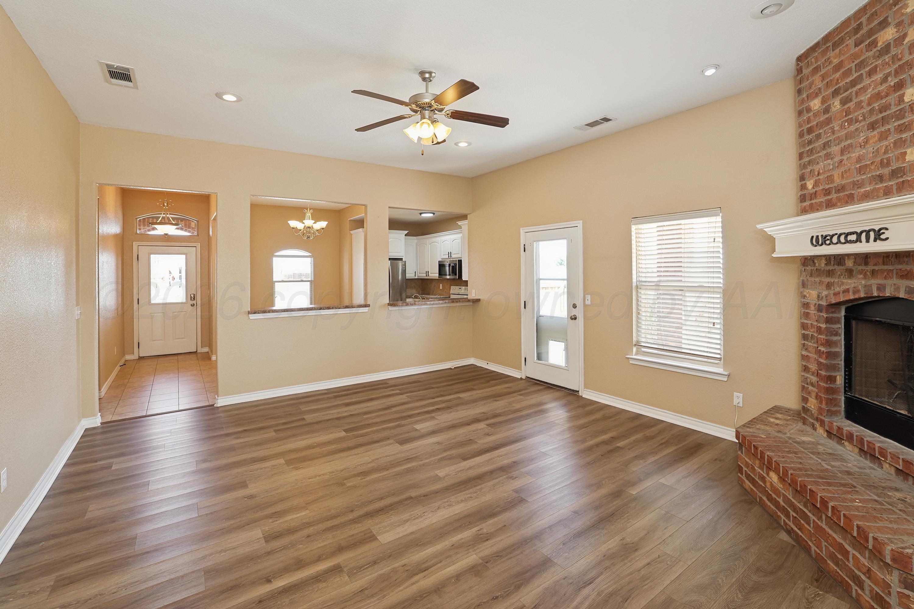 19101 Sundancer Lane Bushland, TX 79124 - Photo 7 of 25 a view of an empty room with window and wooden floor