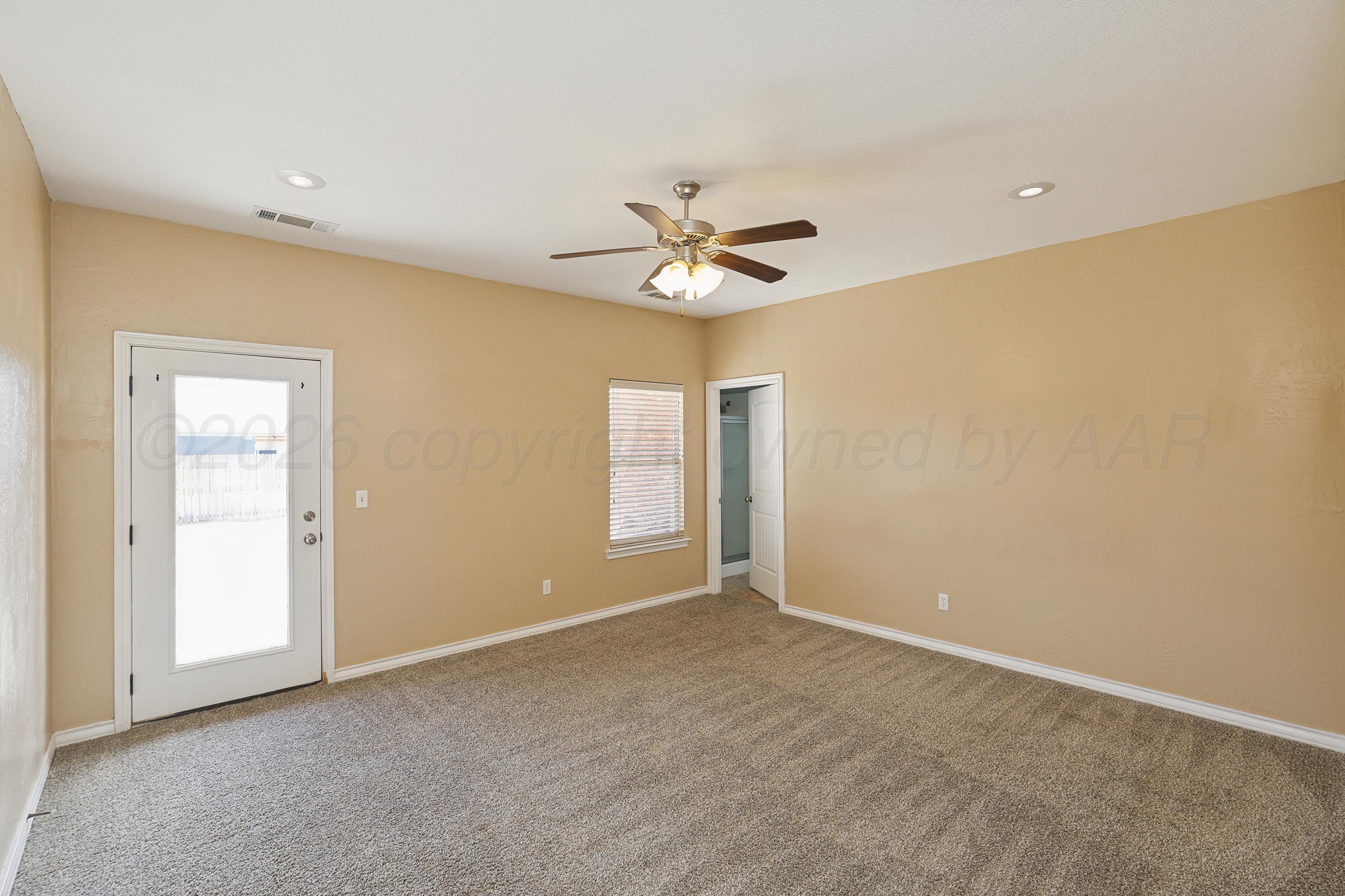 19101 Sundancer Lane Bushland, TX 79124 - Photo 8 of 25 a view of a room with a ceiling fan and a window