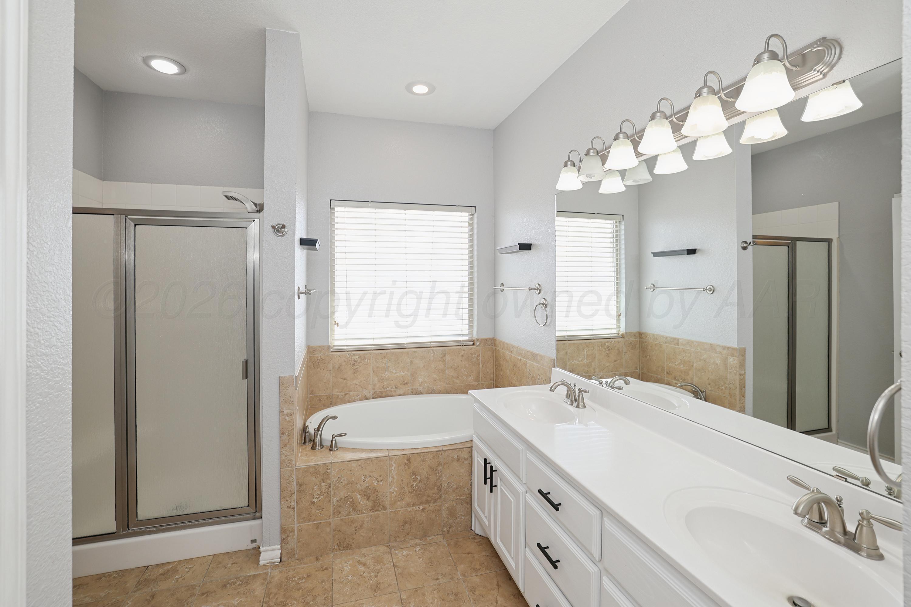 19101 Sundancer Lane Bushland, TX 79124 - Photo 10 of 25 a bathroom with a tub sink and mirror