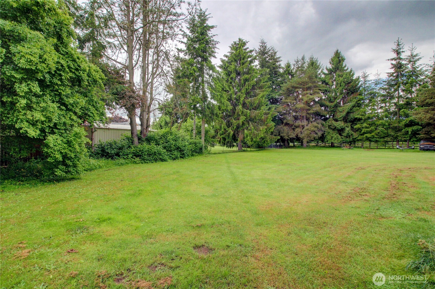 7185 Old Highway 99 North Road Burlington, WA 98233 - Photo 14 of 26 a view of a big yard with plants and large trees