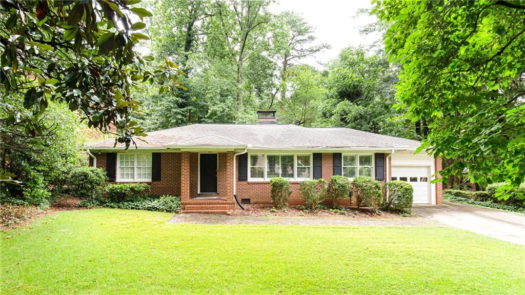 1095 Canter Road Northeast Atlanta, GA 30324 - Photo 1 of 1 front view of a house with a yard