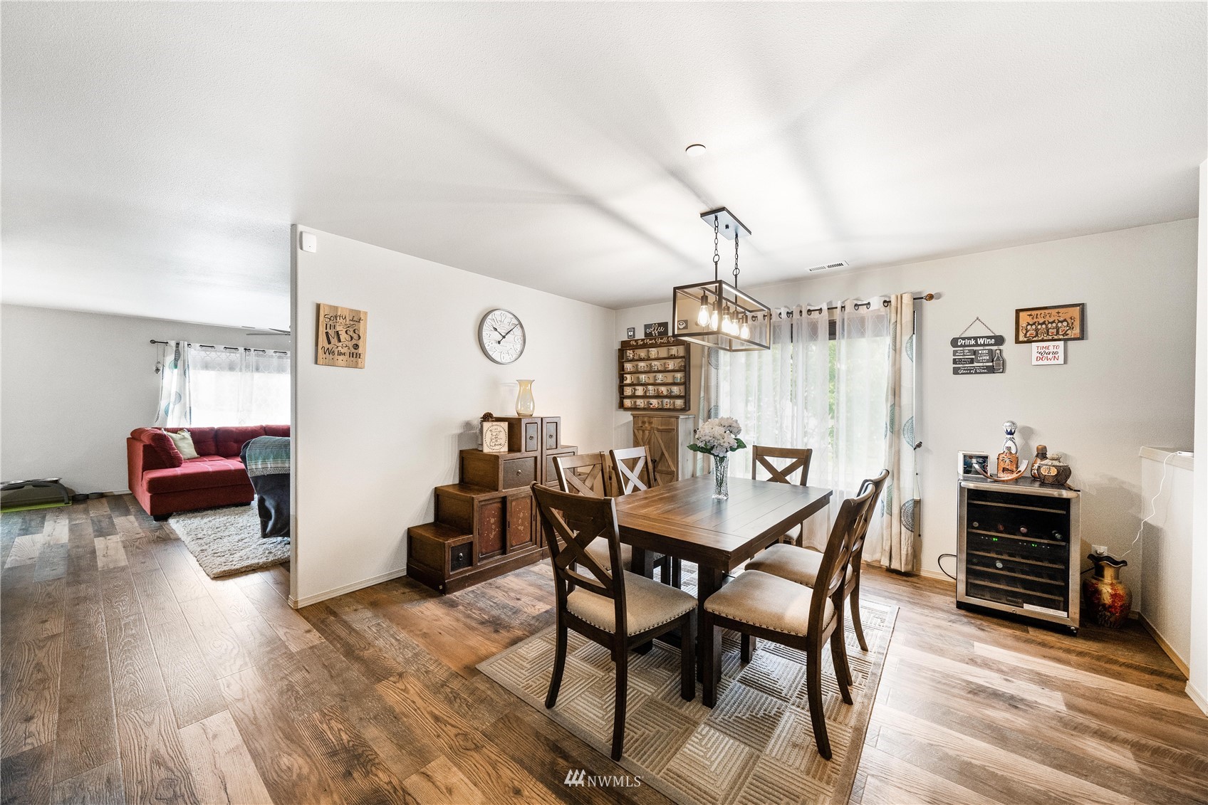 1589 Grant Avenue DuPont, WA 98327 - Photo 11 of 30 a view of a dining room with furniture and wooden floor
