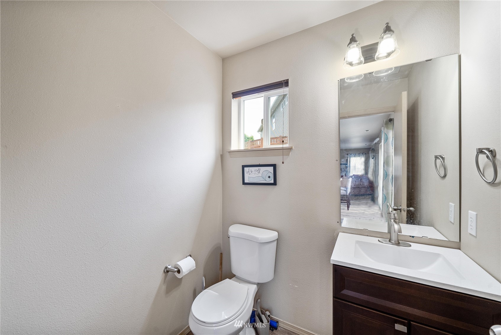 1589 Grant Avenue DuPont, WA 98327 - Photo 13 of 30 a bathroom with a toilet a sink and mirror