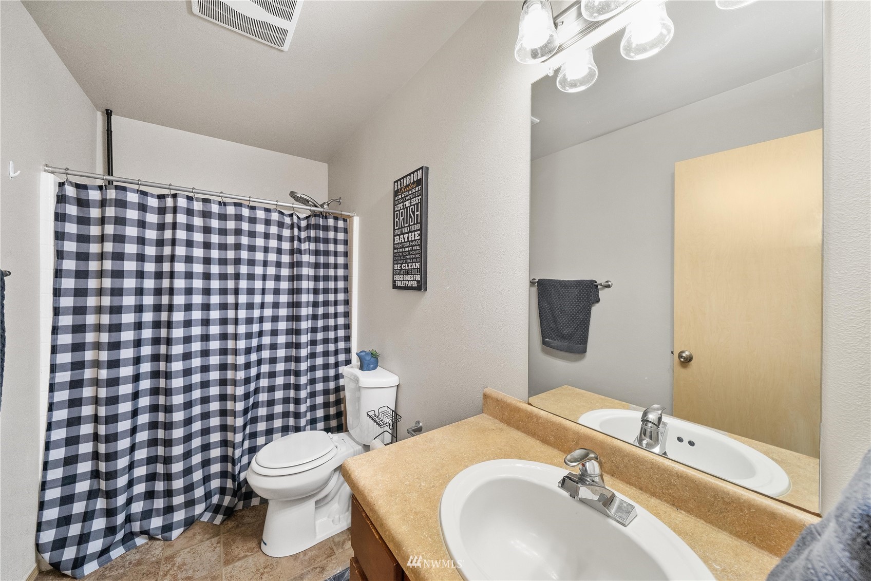 1589 Grant Avenue DuPont, WA 98327 - Photo 15 of 30 a bathroom with a sink toilet and shower