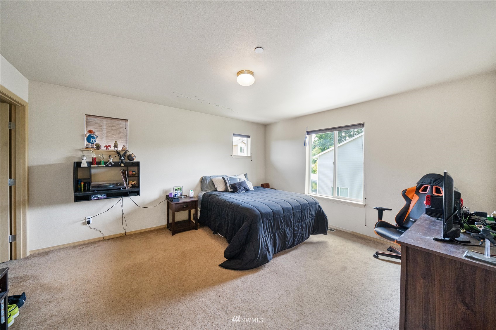 1589 Grant Avenue DuPont, WA 98327 - Photo 16 of 30 a bed room with a bed and a couch