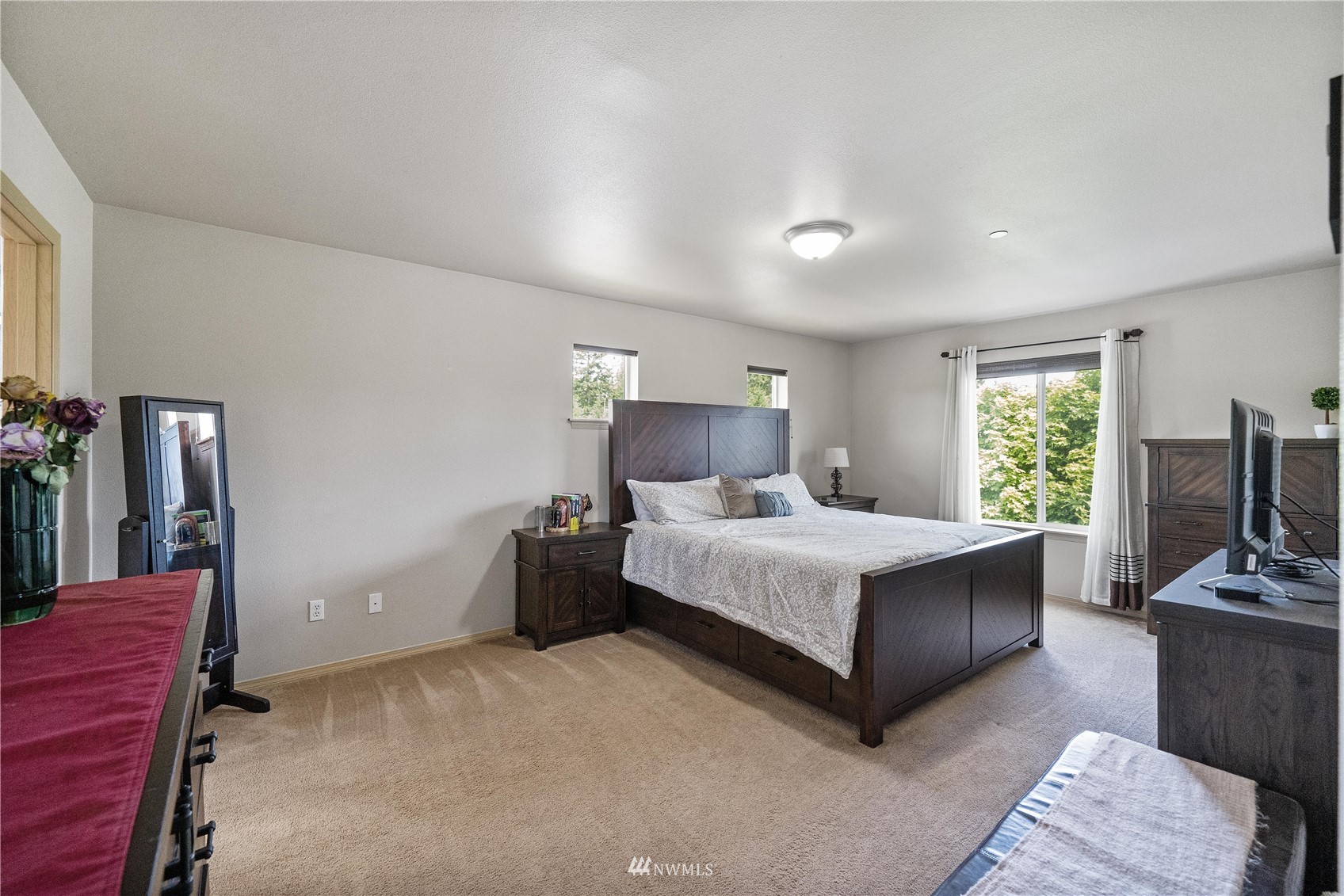 1589 Grant Avenue DuPont, WA 98327 - Photo 20 of 30 a bedroom with a bed flat screen tv and window