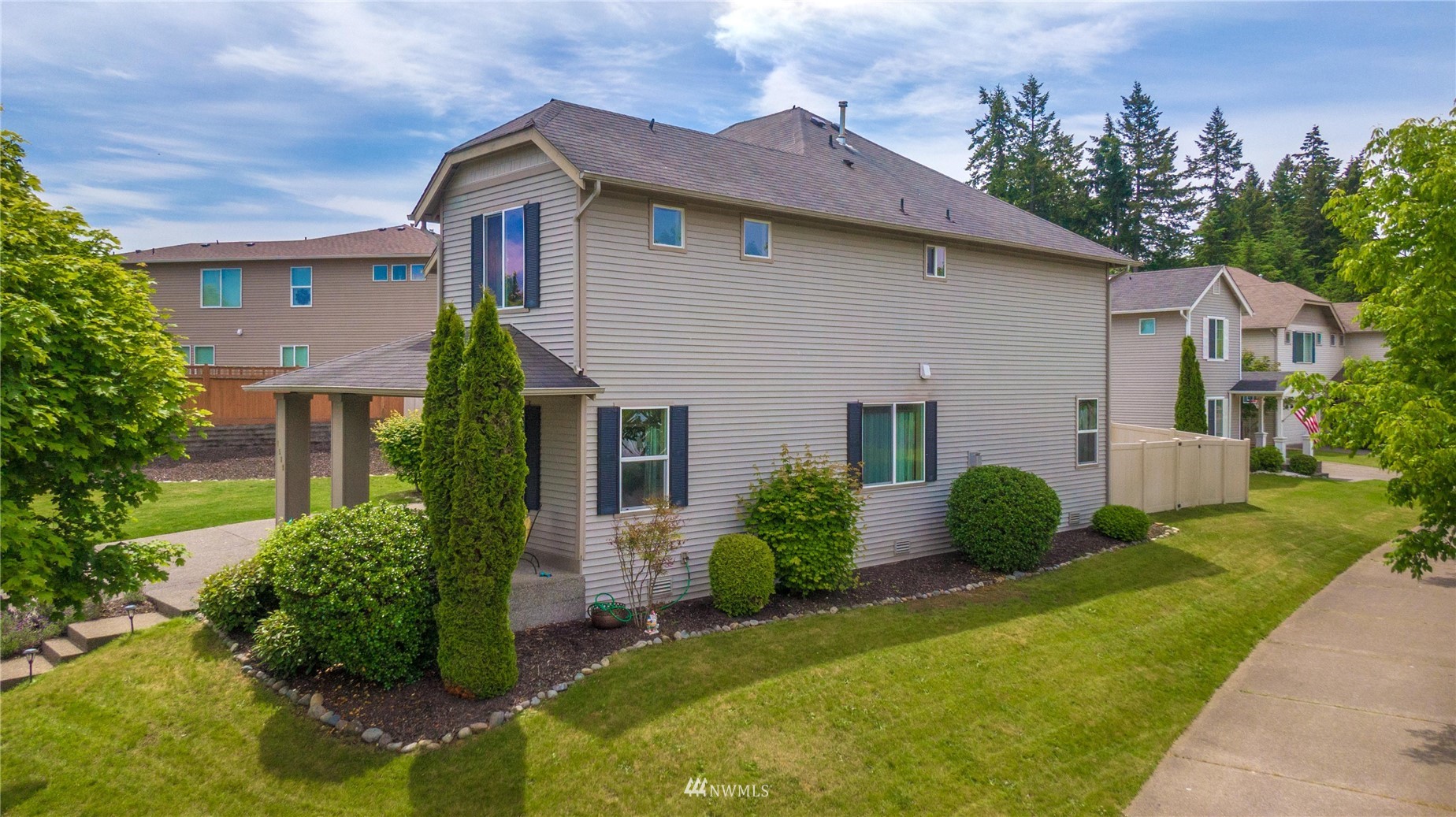 1589 Grant Avenue DuPont, WA 98327 - Photo 2 of 30 a front view of a house with garden