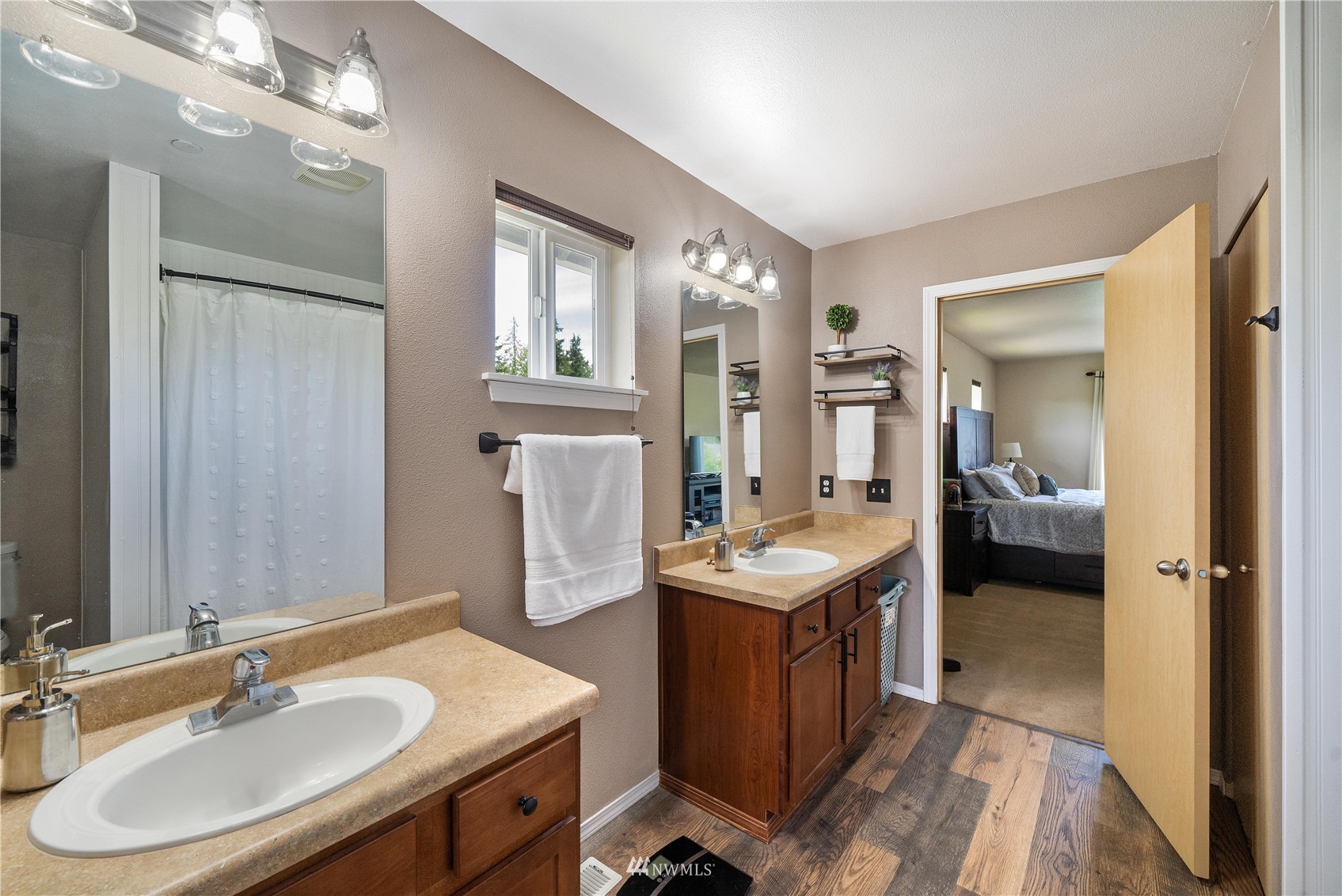 1589 Grant Avenue DuPont, WA 98327 - Photo 23 of 30 a en suite bathroom with a sink double vanity and a mirror
