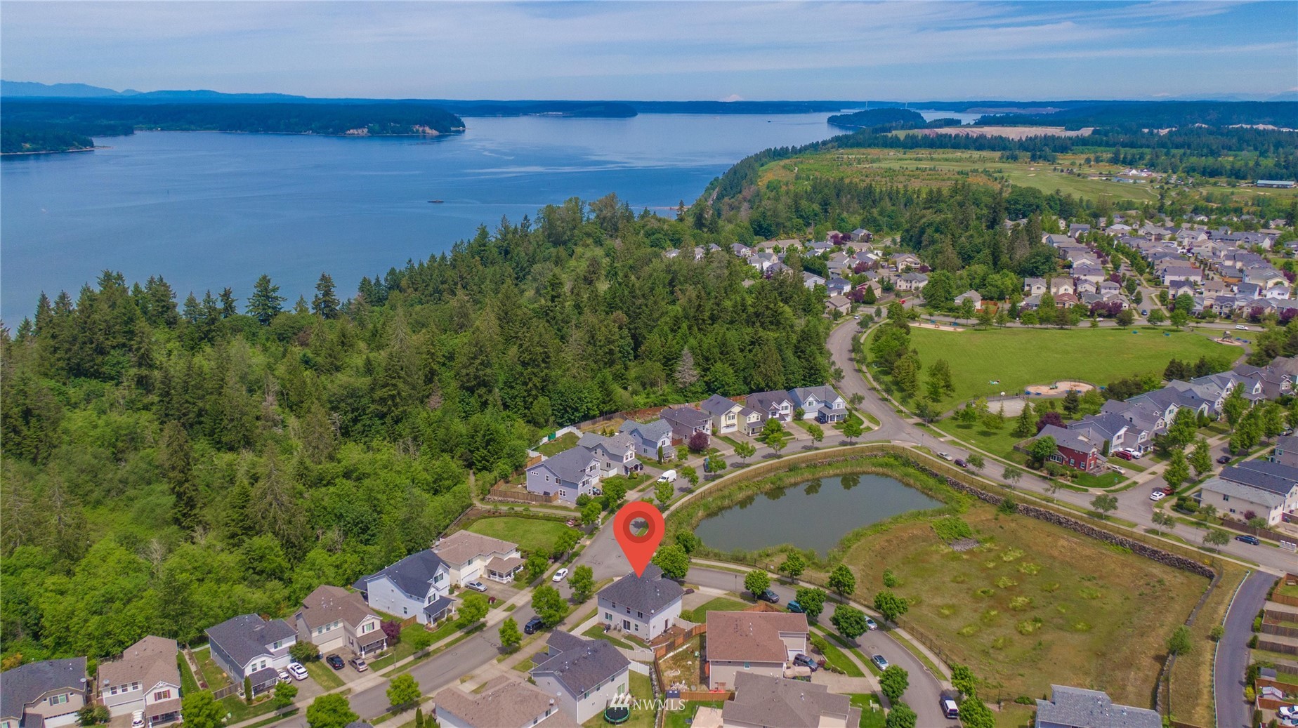 1589 Grant Avenue DuPont, WA 98327 - Photo 30 of 30 an aerial view of a house with a garden and lake view