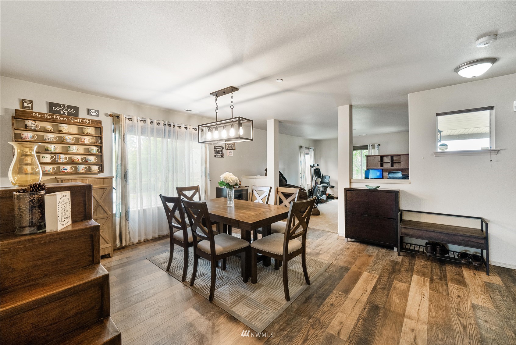 1589 Grant Avenue DuPont, WA 98327 - Photo 10 of 30 a view of a dining room with furniture and wooden floor