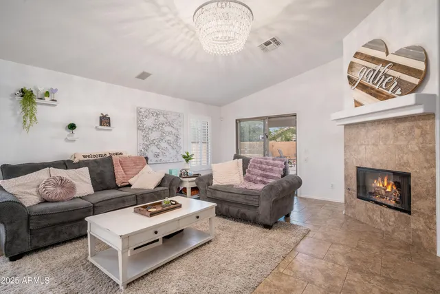 a view of living room with furniture and a flat screen tv