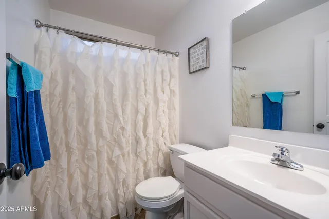 a bedroom with furniture and a baby crib