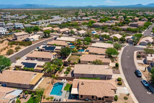 a bathroom with a sink mirror and vanity