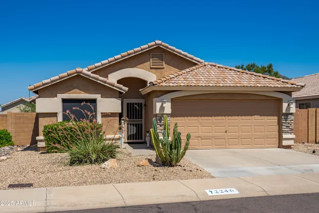 a kitchen with refrigerator and cabinets