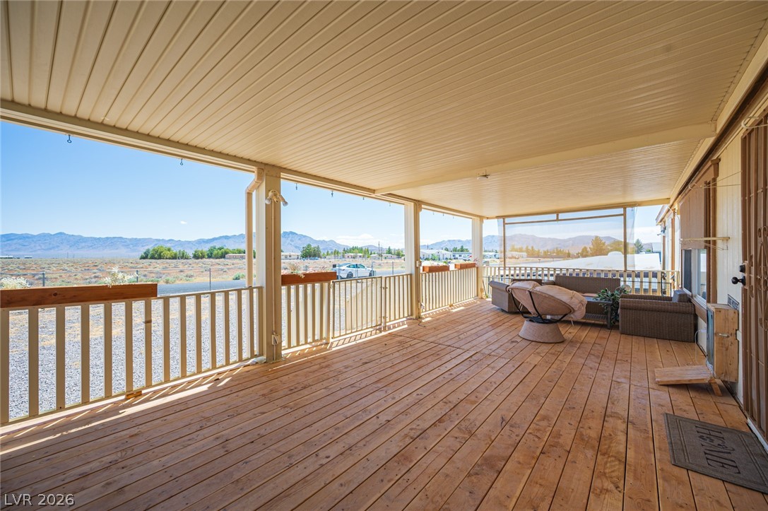 3200 Maple Road Pahrump, NV 89048 - Photo 6 of 53 A spacious covered porch offers commanding views of the distant mountains and desert landscape.