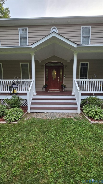 1836 Rocky Ford Road Powhatan, VA 23139 - Photo 3 of 3 Front exterior featuring a covered porch, red entr