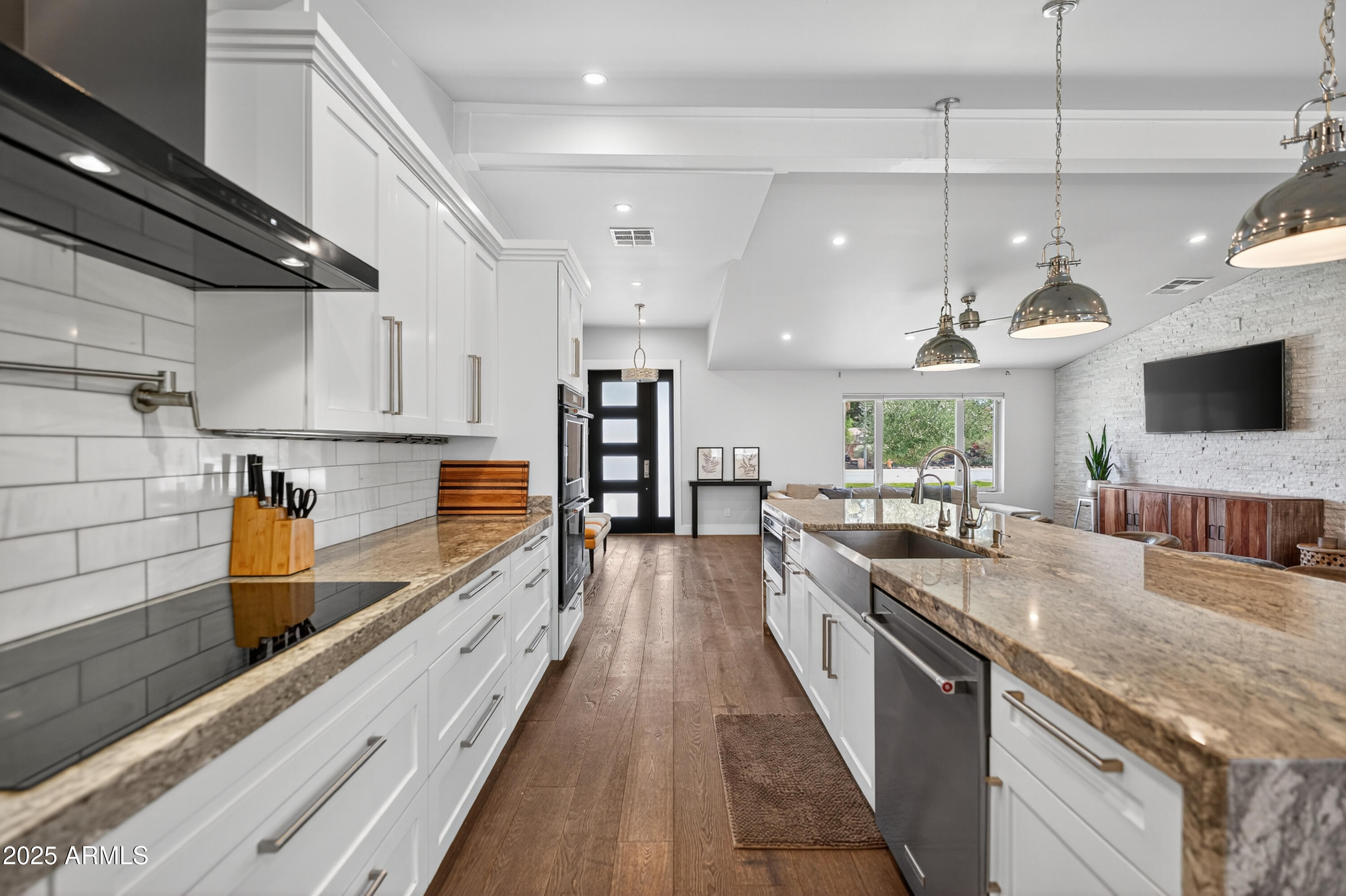 11026 North 42nd Street Phoenix, AZ 85028 - Photo 10 of 43 a large kitchen with stainless steel appliances lots of counter space and a sink