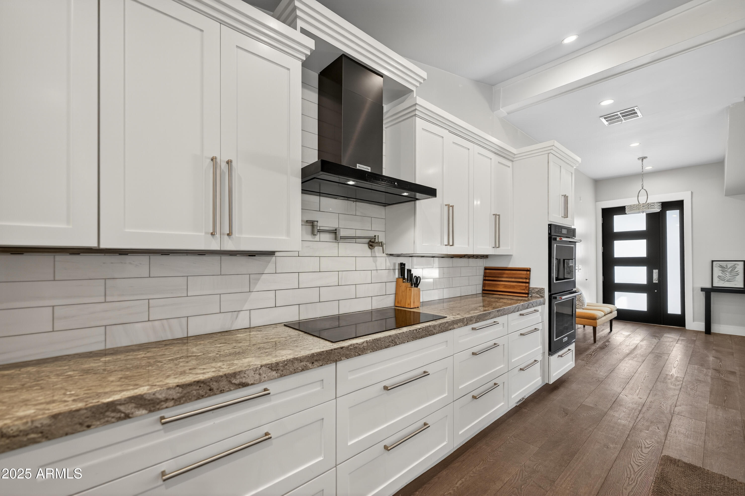 11026 North 42nd Street Phoenix, AZ 85028 - Photo 11 of 43 a kitchen with granite countertop a sink stainless steel appliances and cabinets