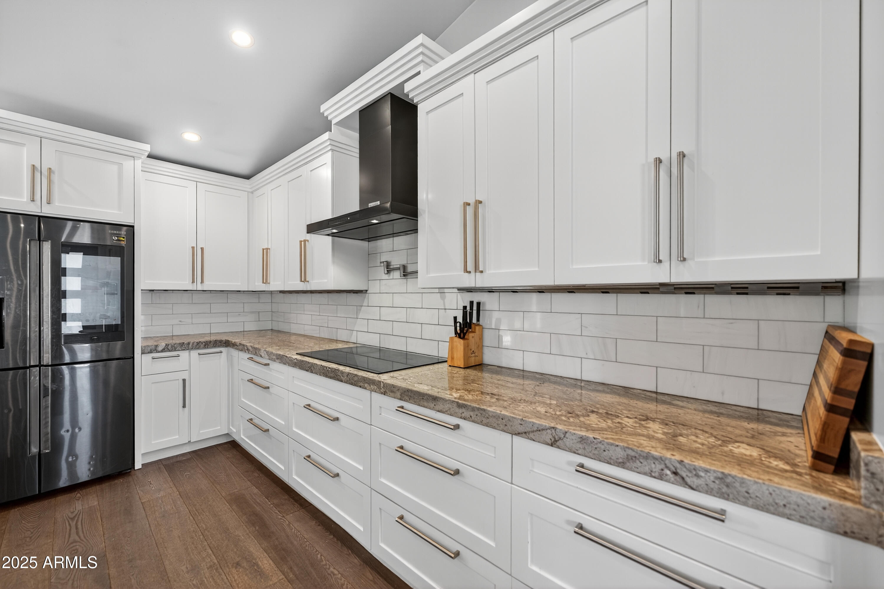 11026 North 42nd Street Phoenix, AZ 85028 - Photo 13 of 43 a kitchen with granite countertop white cabinets and stainless steel appliances