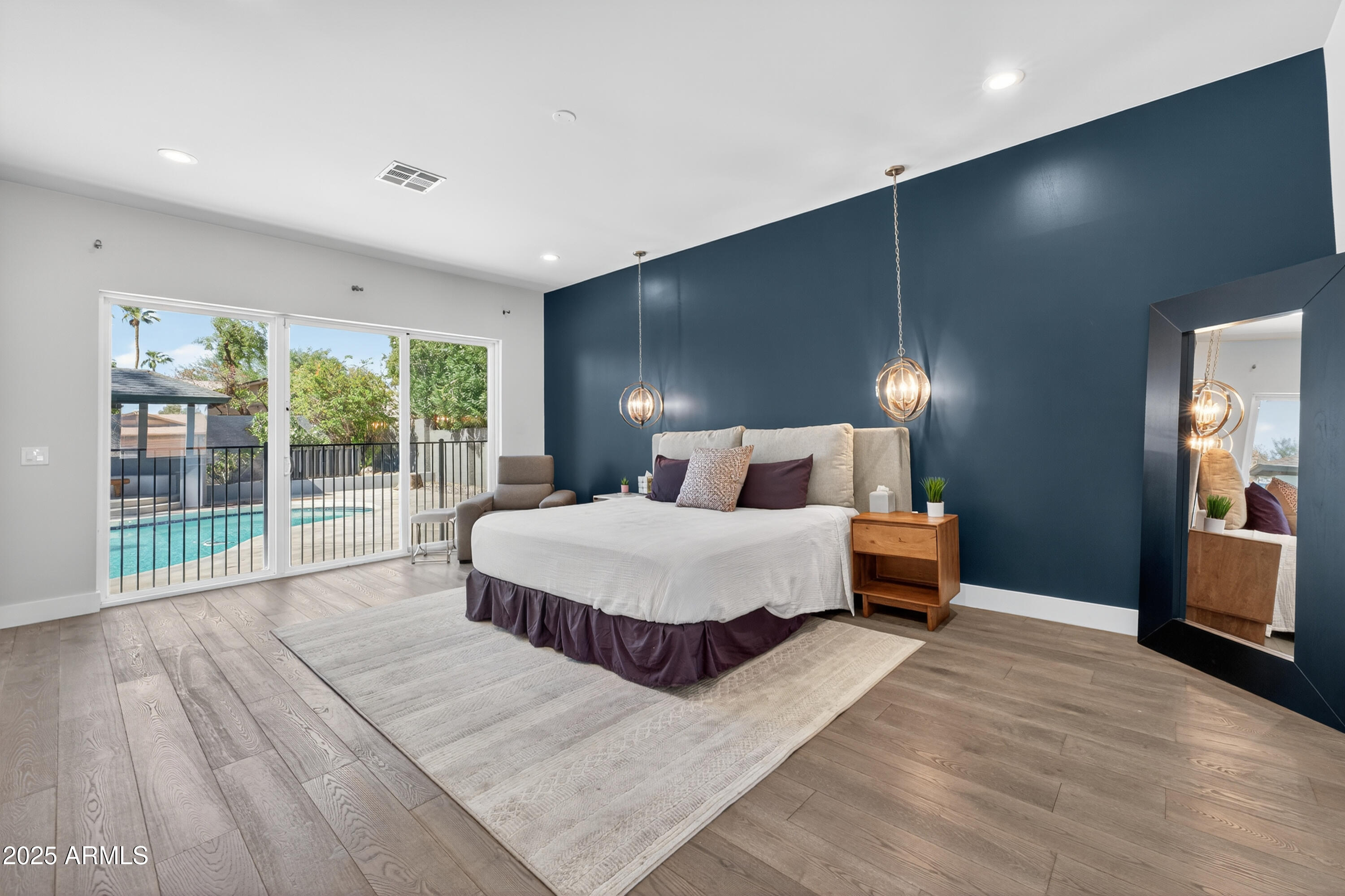 11026 North 42nd Street Phoenix, AZ 85028 - Photo 16 of 43 a bedroom with a large bed and a large window