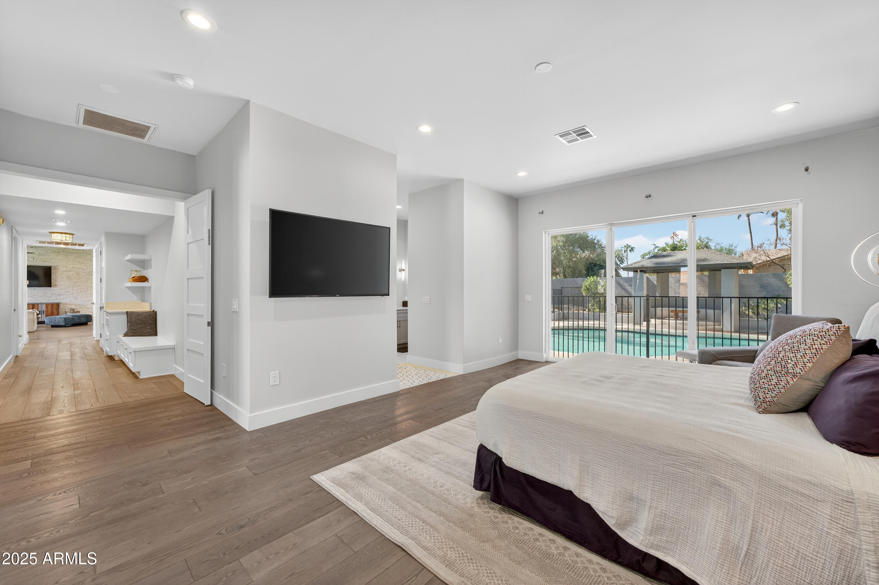 11026 North 42nd Street Phoenix, AZ 85028 - Photo 17 of 43 a large bedroom with a bed and large window