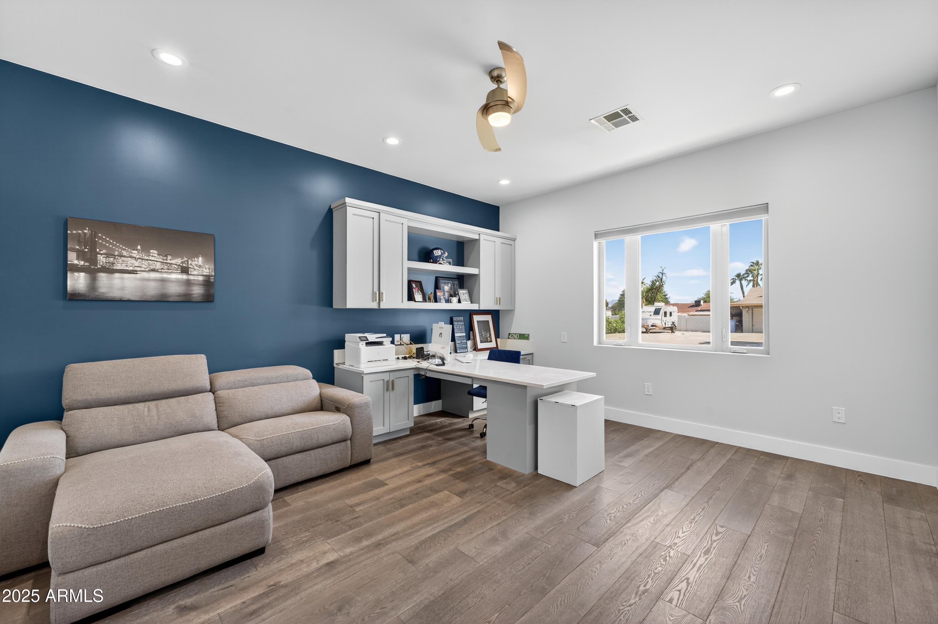 11026 North 42nd Street Phoenix, AZ 85028 - Photo 19 of 43 a living room with furniture and a wooden floor