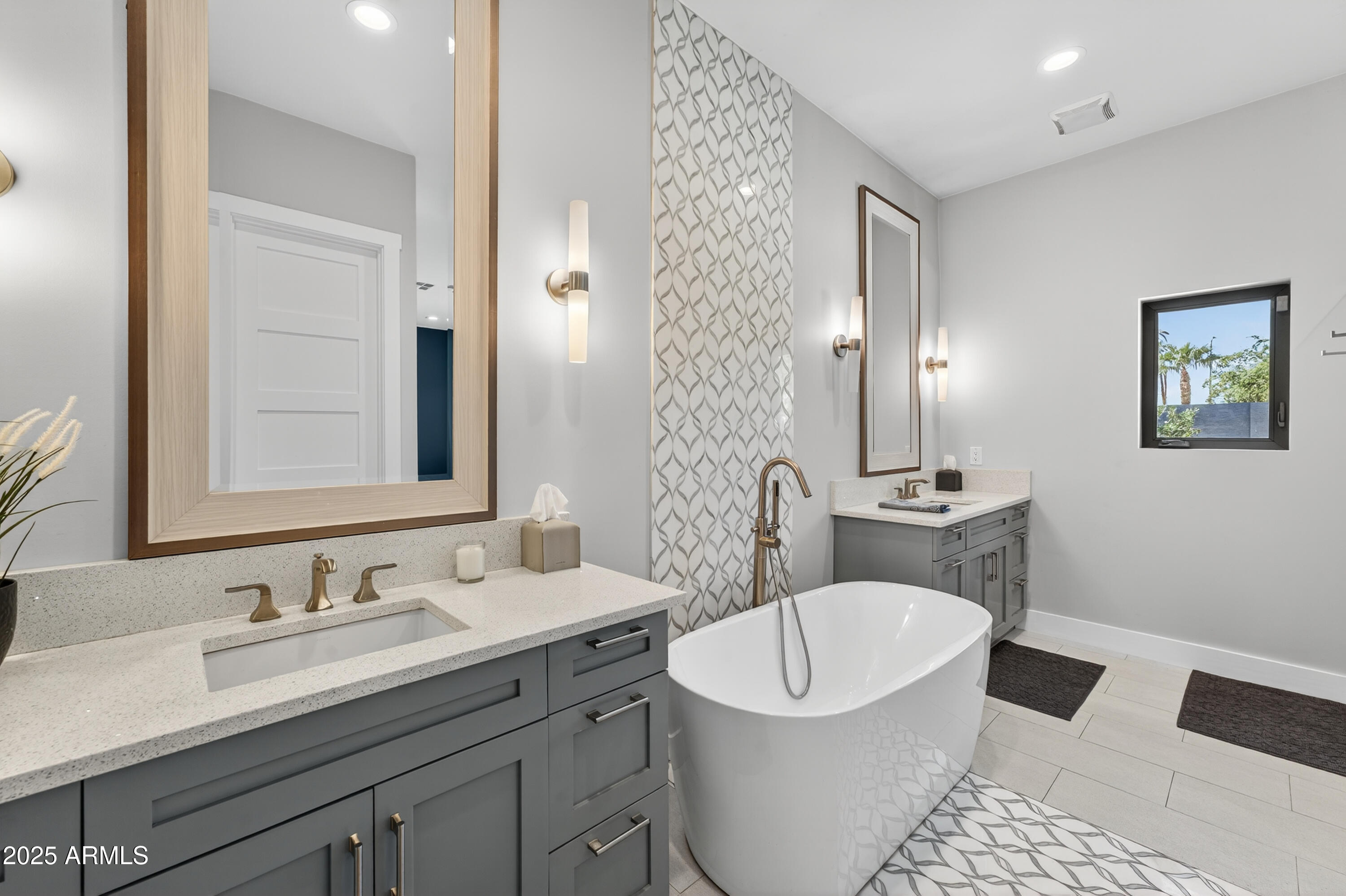 11026 North 42nd Street Phoenix, AZ 85028 - Photo 23 of 43 a bathroom with a toilet a sink a mirror and a shower