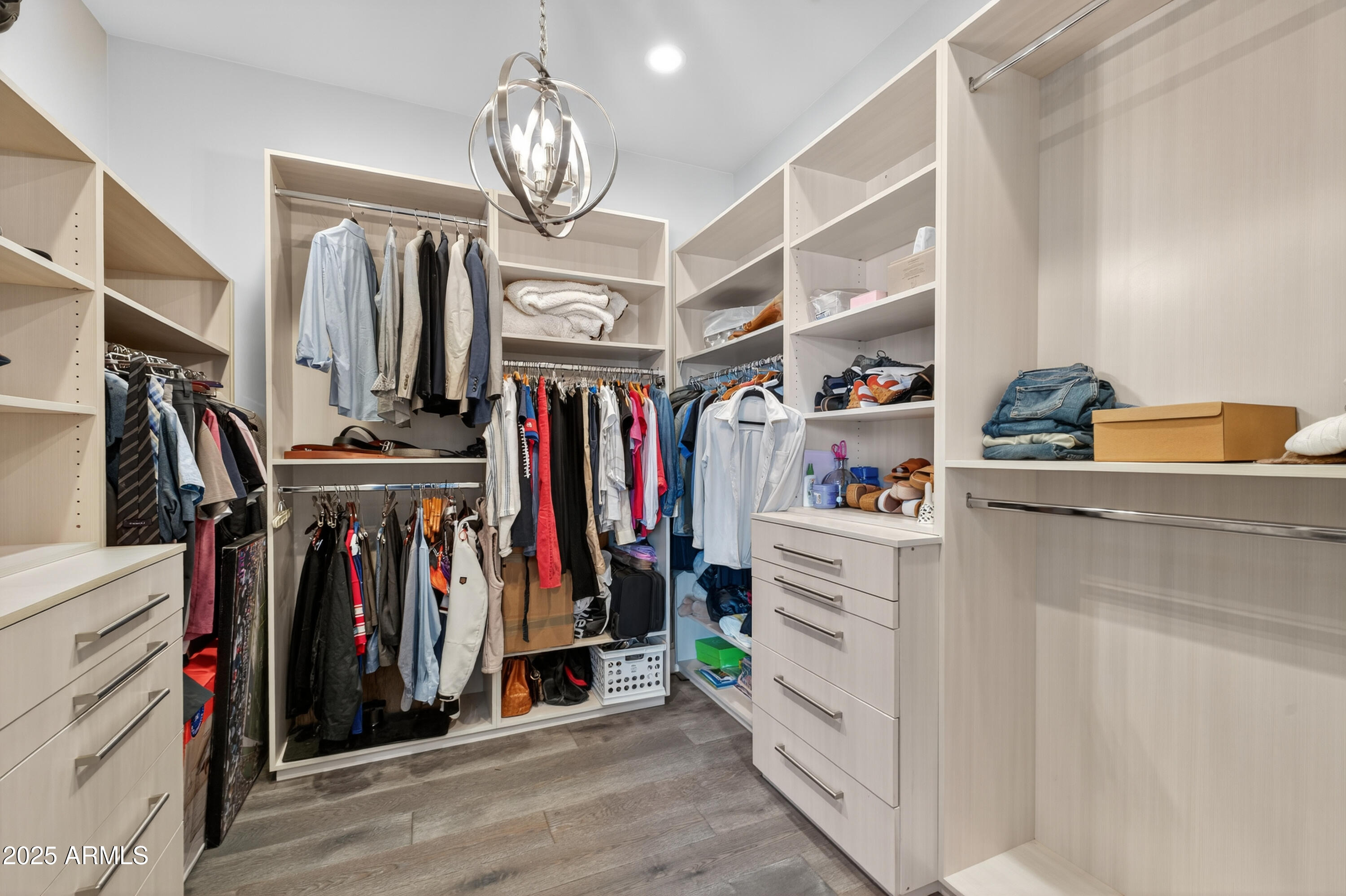 11026 North 42nd Street Phoenix, AZ 85028 - Photo 24 of 43 a view of walk in closet with clothes and shoes