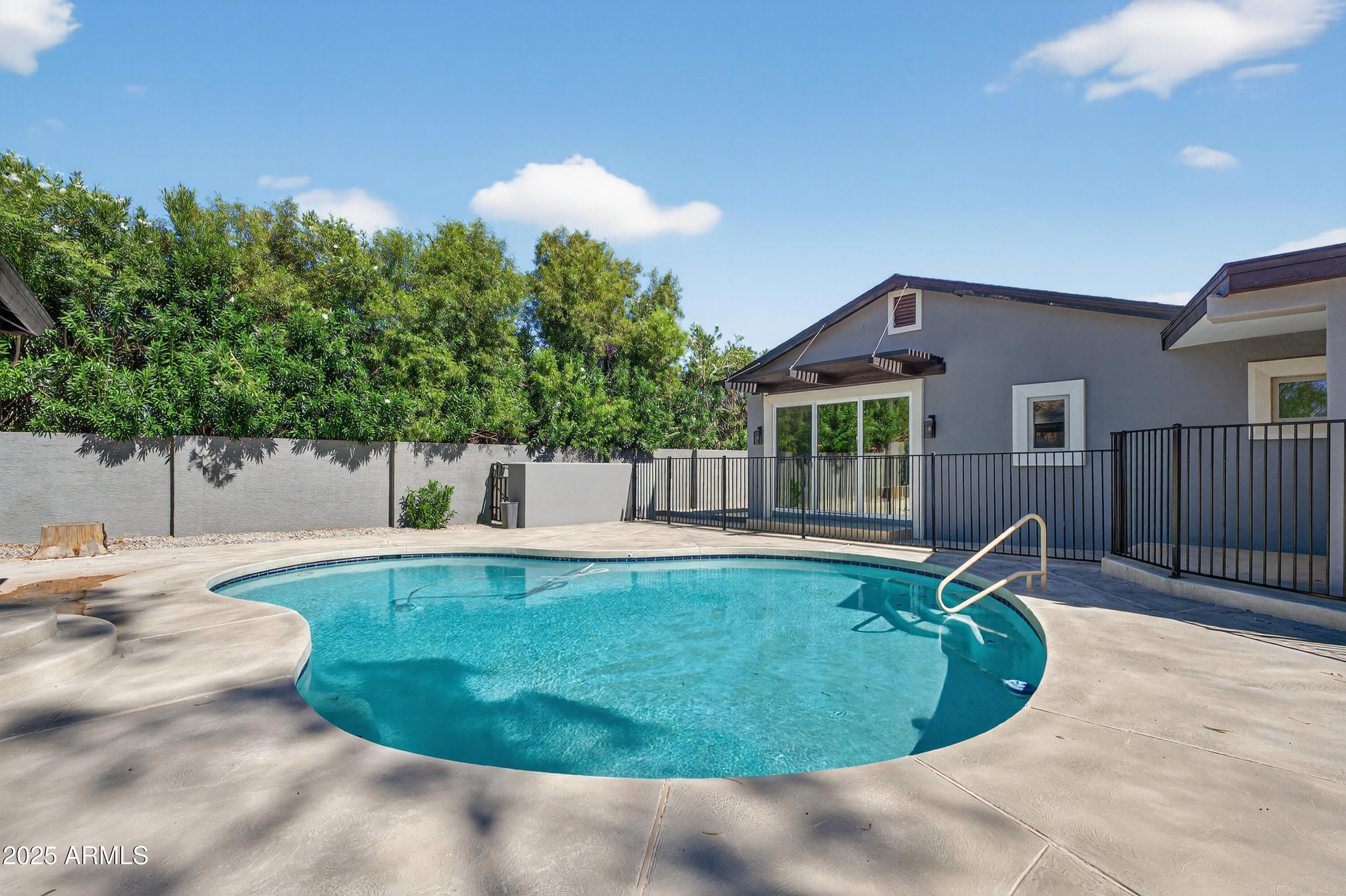 11026 North 42nd Street Phoenix, AZ 85028 - Photo 36 of 43 a view of a swimming pool with a patio
