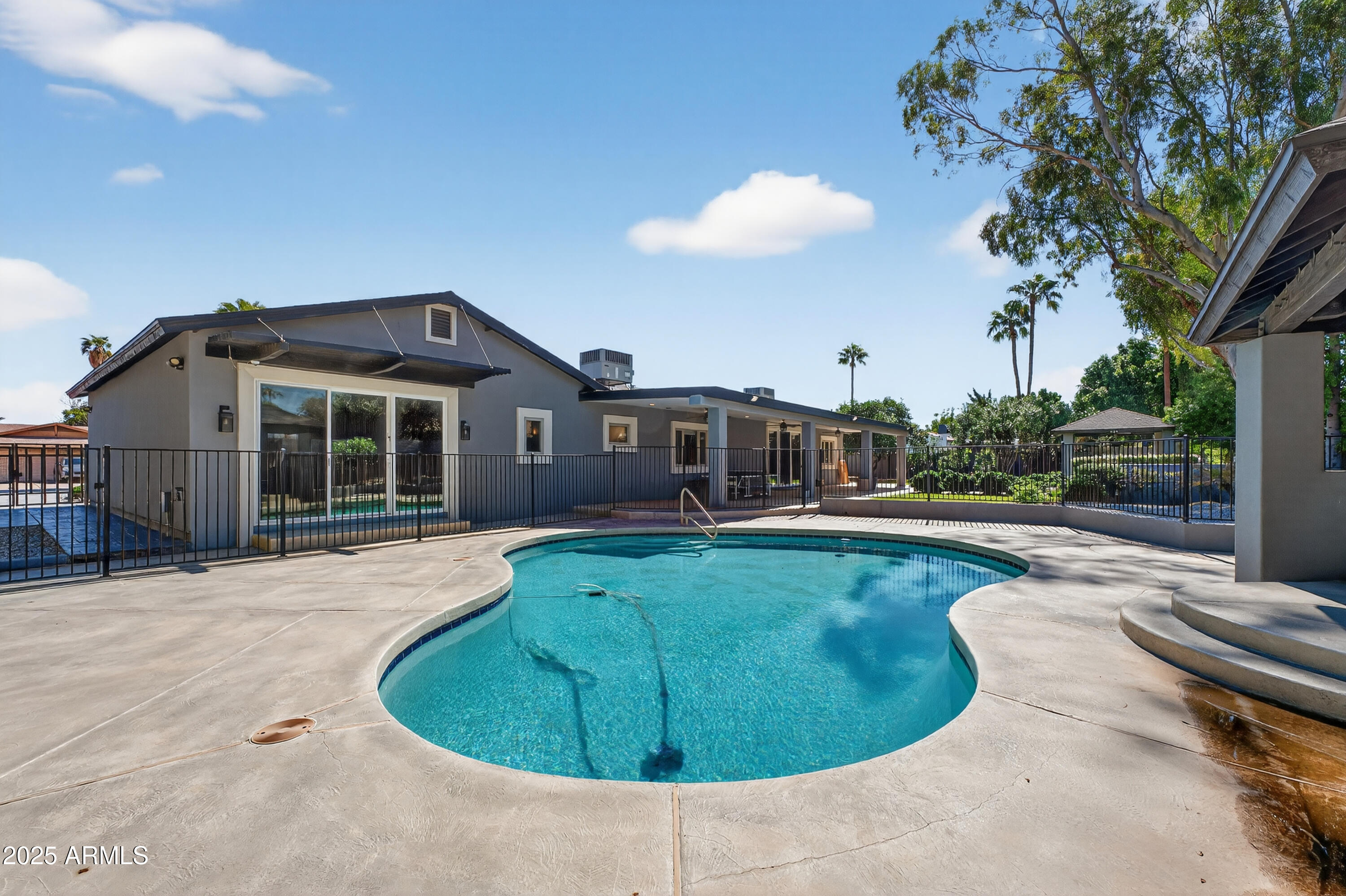 11026 North 42nd Street Phoenix, AZ 85028 - Photo 37 of 43 a view of a house with a backyard