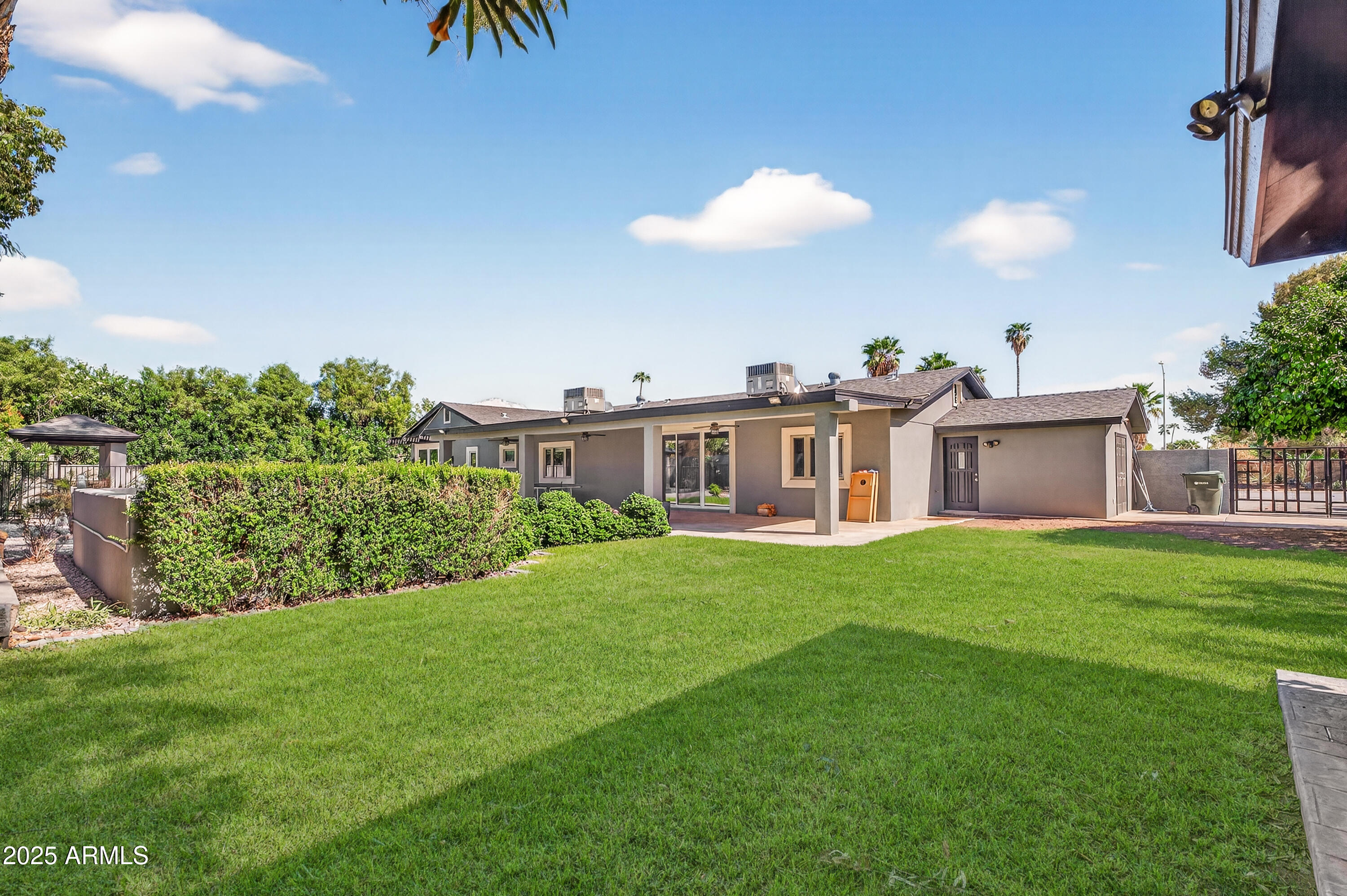 11026 North 42nd Street Phoenix, AZ 85028 - Photo 39 of 43 a view of a house with a backyard