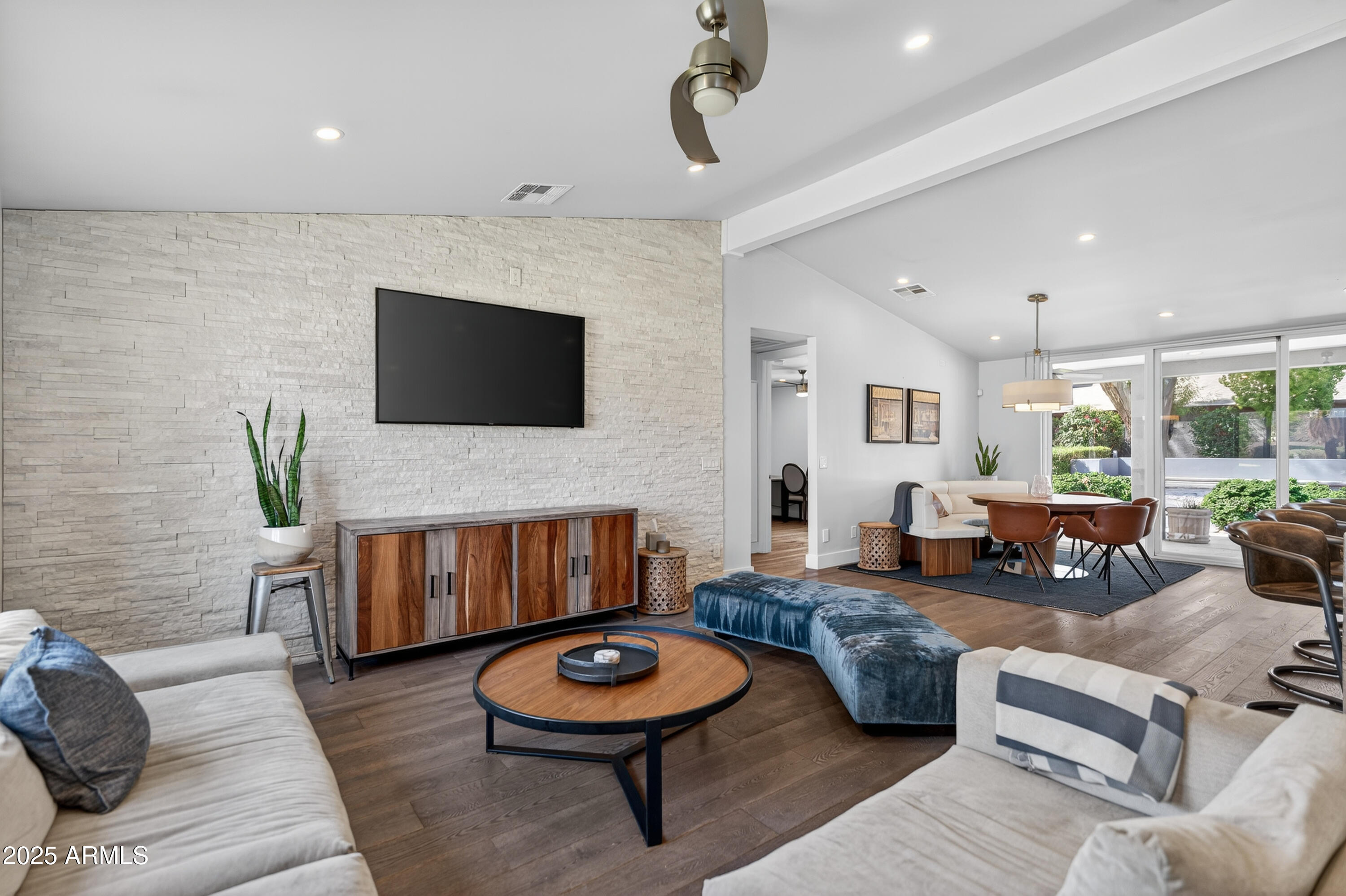 11026 North 42nd Street Phoenix, AZ 85028 - Photo 3 of 43 a living room with furniture and a flat screen tv
