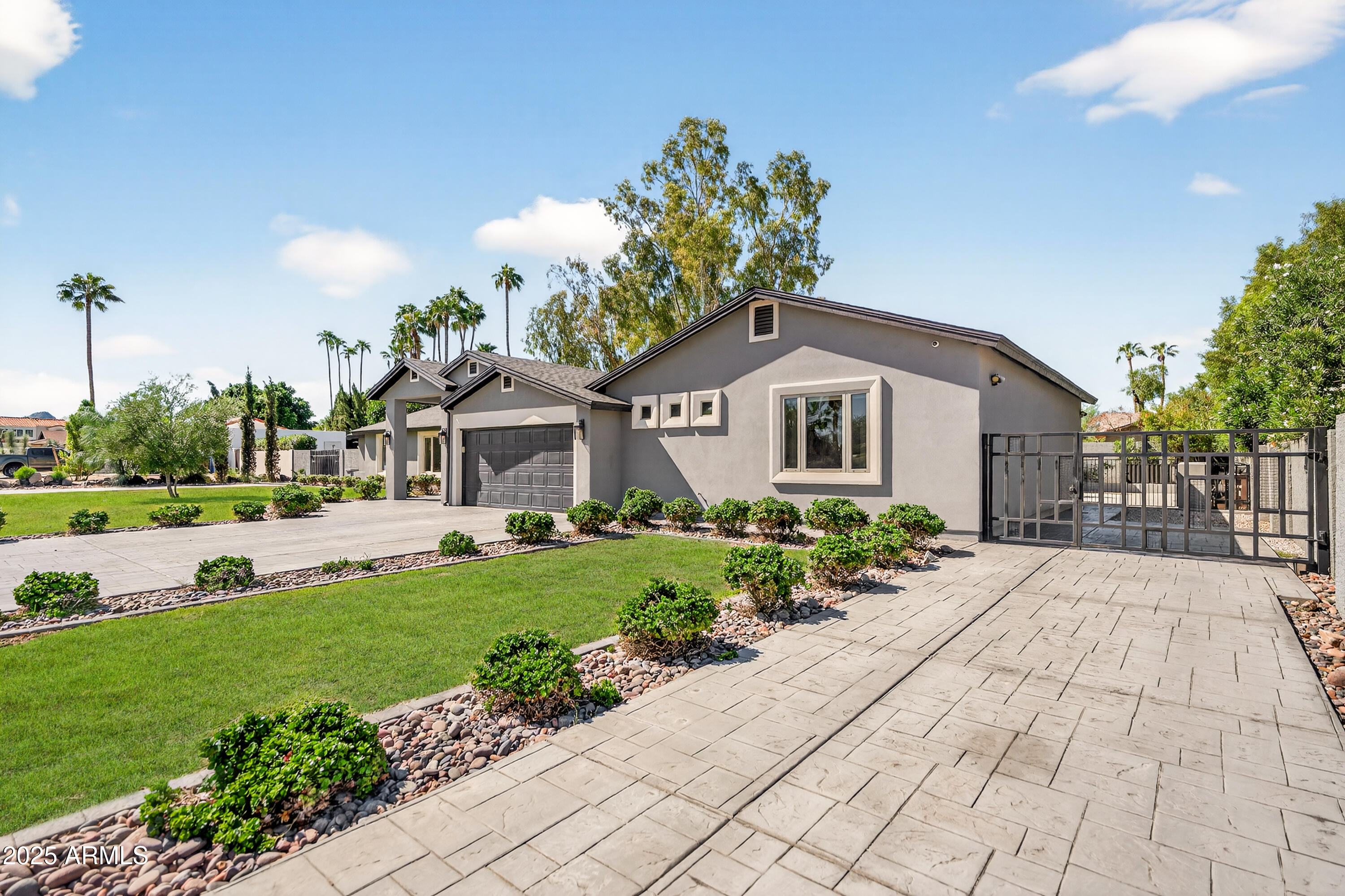 11026 North 42nd Street Phoenix, AZ 85028 - Photo 42 of 43 a front view of a house with a yard