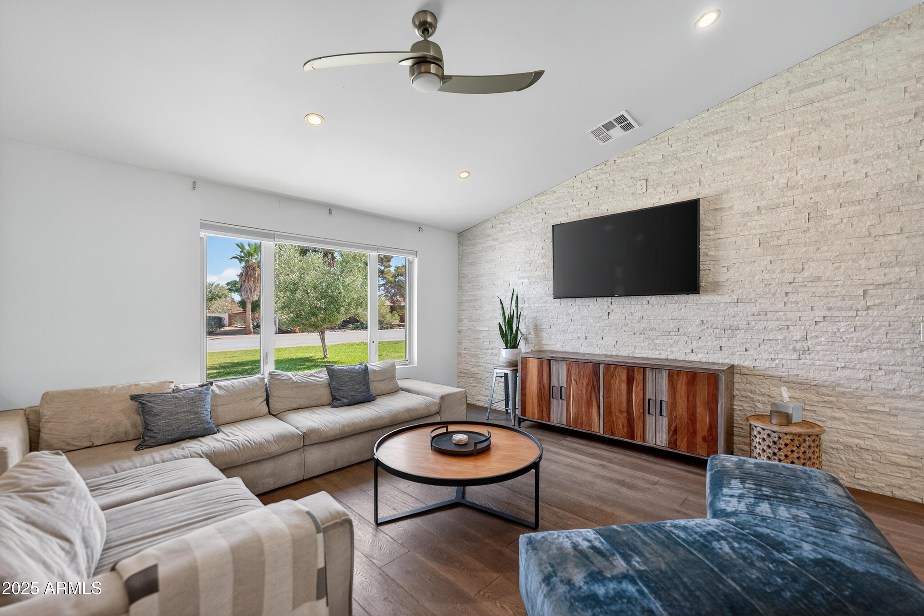 11026 North 42nd Street Phoenix, AZ 85028 - Photo 5 of 43 a living room with furniture and a flat screen tv