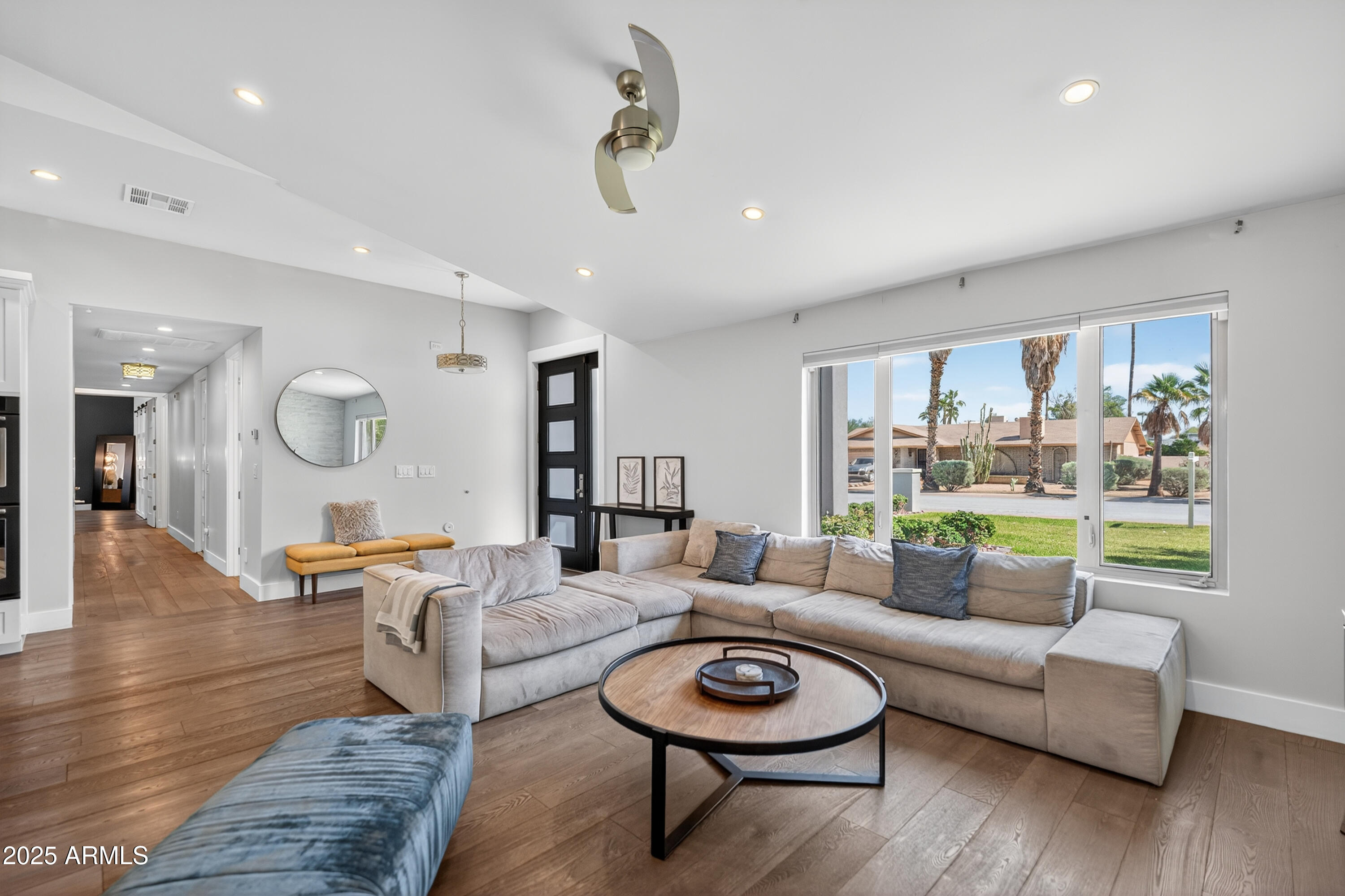11026 North 42nd Street Phoenix, AZ 85028 - Photo 6 of 43 a living room with furniture and a large window