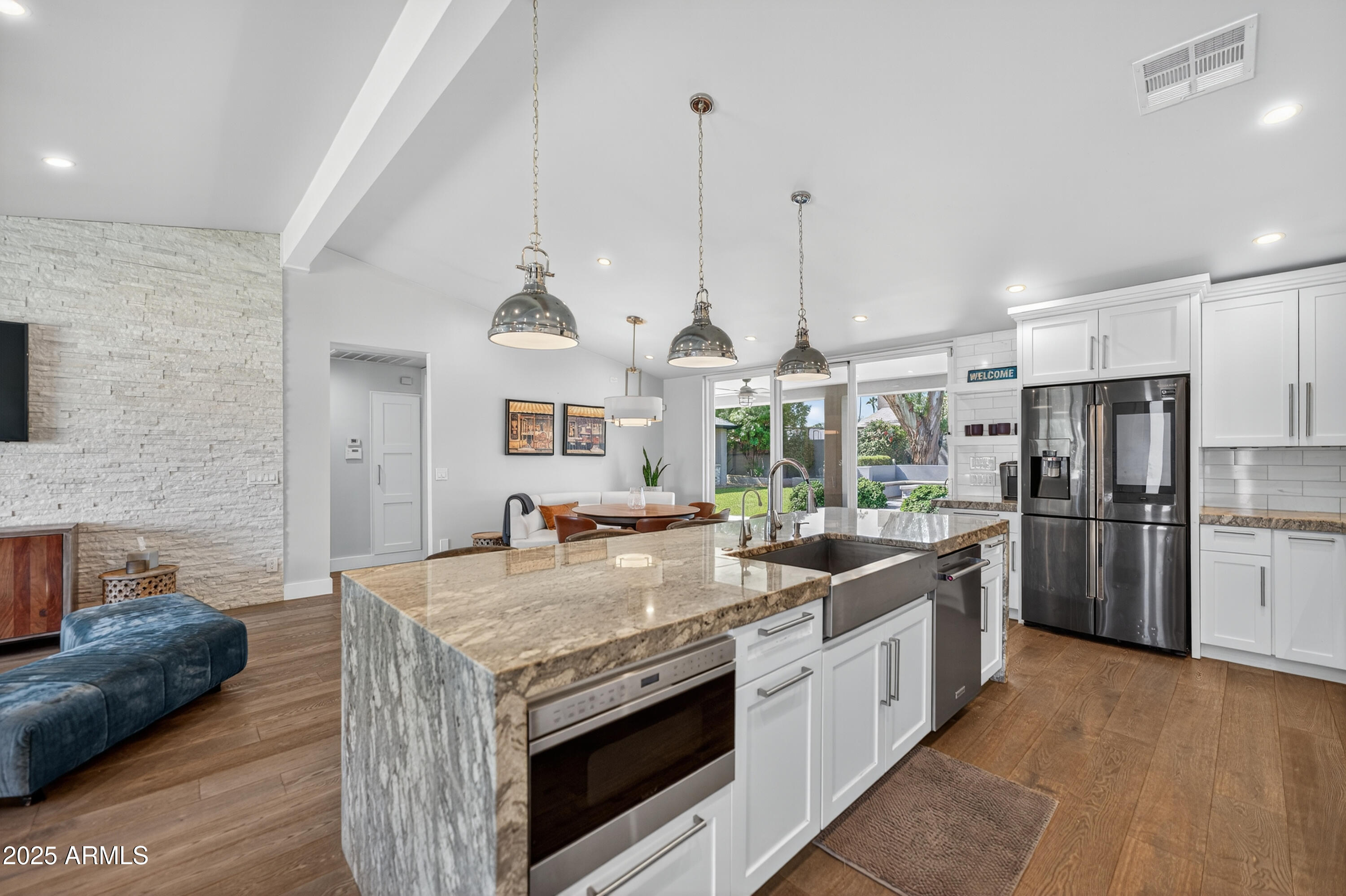 11026 North 42nd Street Phoenix, AZ 85028 - Photo 7 of 43 a kitchen with stainless steel appliances granite countertop a stove and a refrigerator
