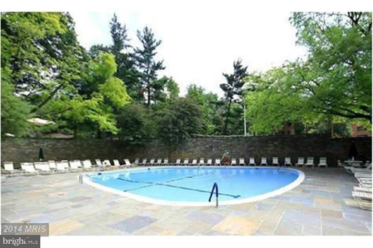 4000 Tunlaw Road Northwest, Unit 414 Washington, DC 20007 - Photo 12 of 14 a view of a swimming pool with an outdoor space