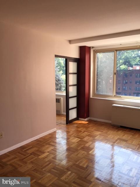 4000 Tunlaw Road Northwest, Unit 414 Washington, DC 20007 - Photo 2 of 14 a view of an empty room with a window