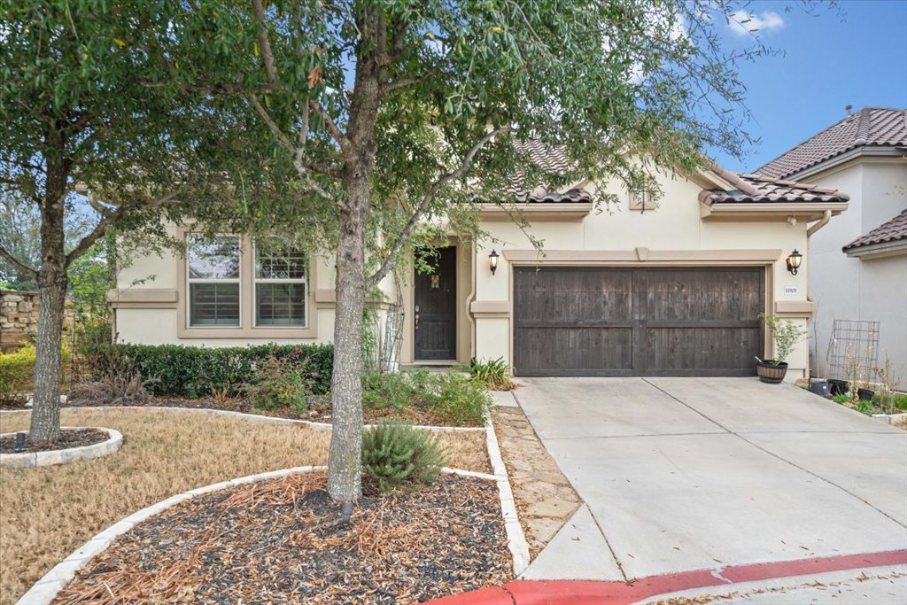 11901 Deering Place Austin, TX 78726 - Photo 2 of 40 a front view of a house with a yard and garage