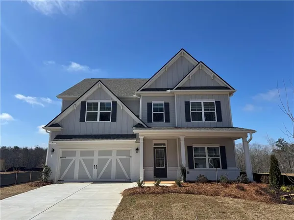 a front view of a house with yard