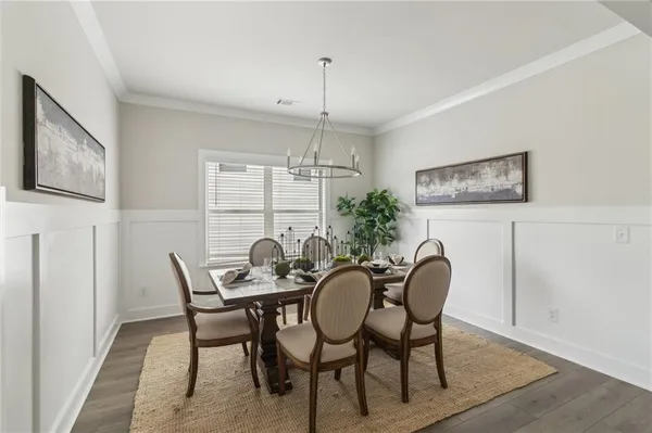 a dining room with furniture and window