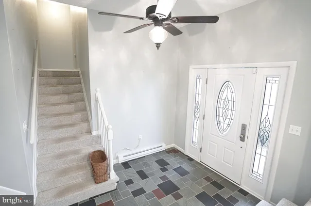 a view of entryway with a front door