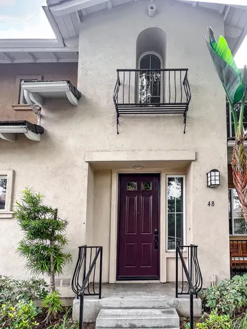 a view of a livingroom with furniture and entryway